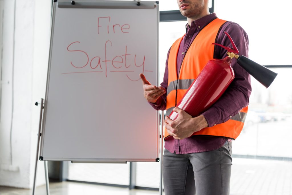 Engineer reviewing fire safety documents for SCDF
