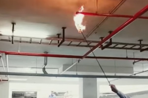 Technicians performing integrated fire system testing